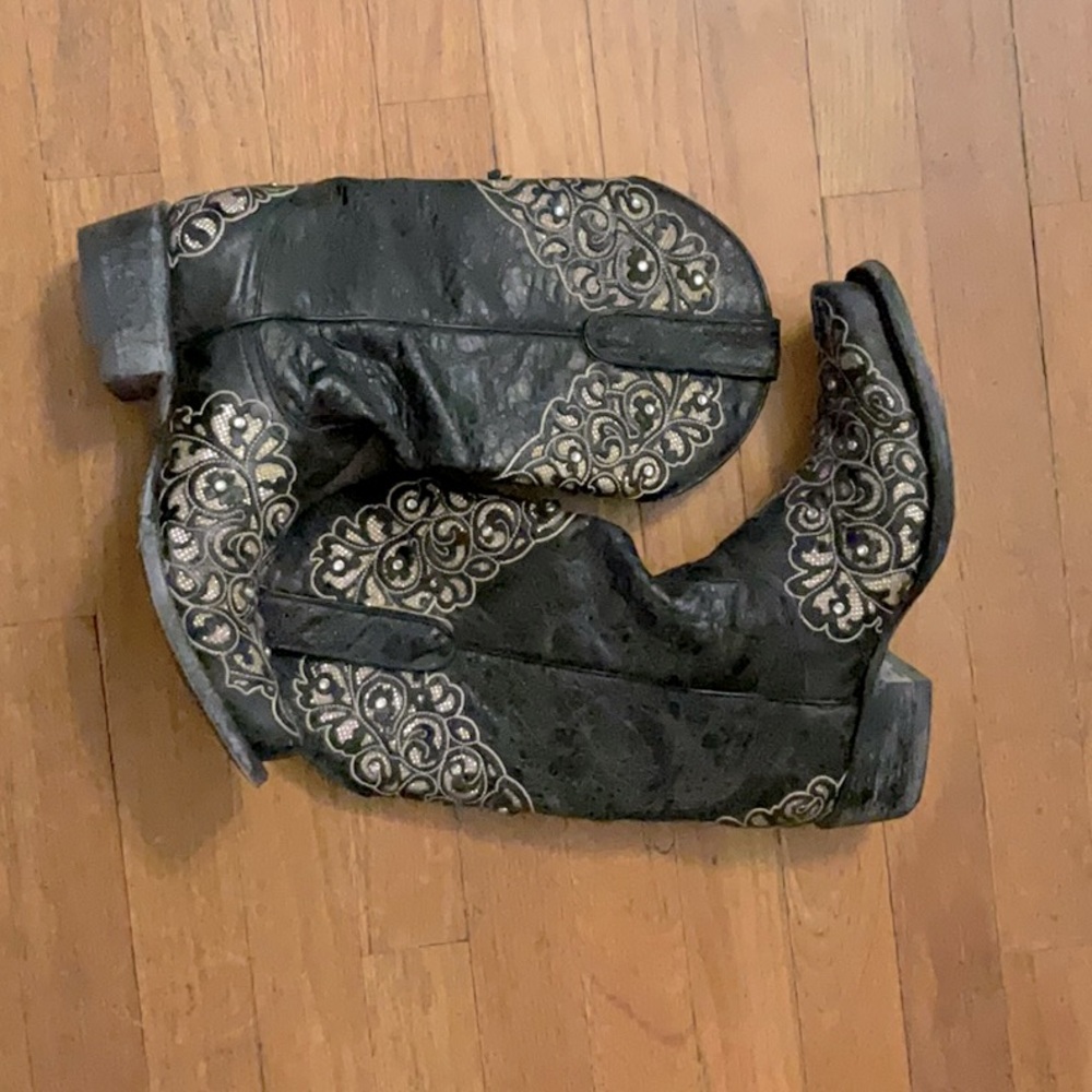 These Yippy Kiyay boots are black with rhinestone touches